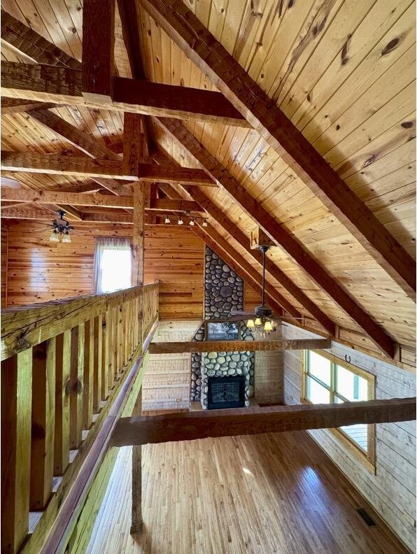 792 Tuggle Rd, Lancaster, KY 40444 - bonus room with wood ceiling, wood walls, wood-type flooring, and a glass covered fireplace