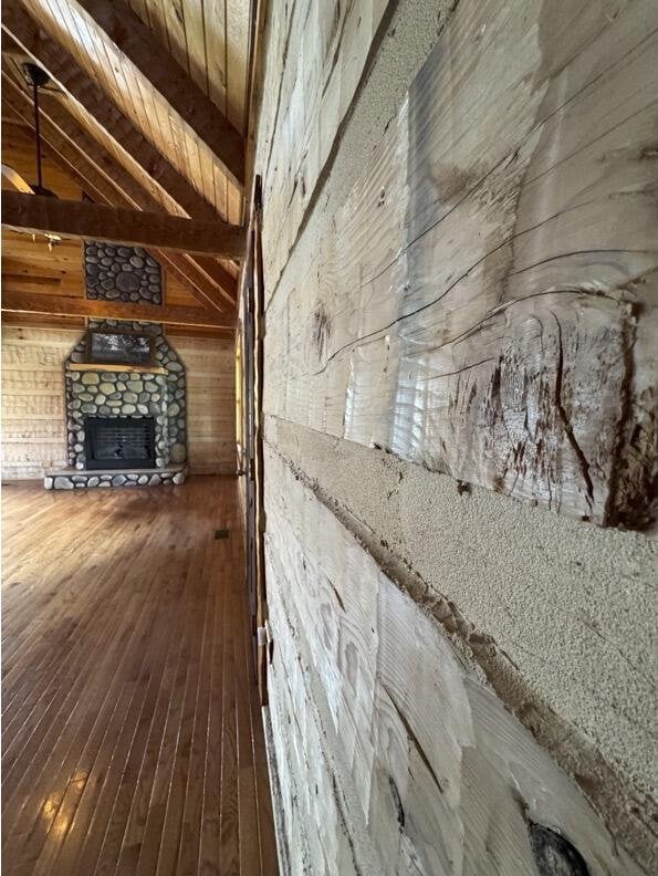 792 Tuggle Rd, Lancaster, KY 40444 - interior space with wooden walls, wood finished floors, and a fireplace