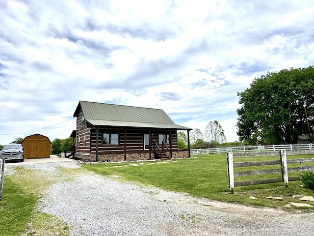 792 Tuggle Rd, Lancaster, KY 40444 - cabin featuring driveway, metal roof, and an outbuilding