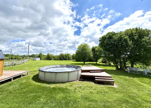 792 Tuggle Rd, Lancaster, KY 40444 - view of property's community with a pool, a storage unit, a deck, and an outdoor structure