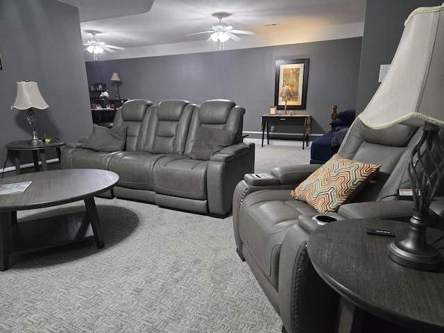 carpeted living room featuring a ceiling fan