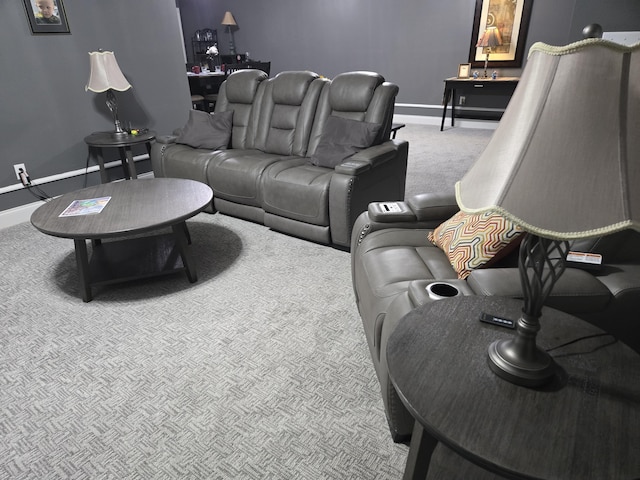 carpeted living room with baseboards