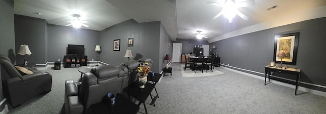 living room featuring carpet, visible vents, lofted ceiling, and a ceiling fan