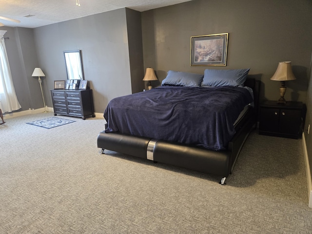 carpeted bedroom with baseboards