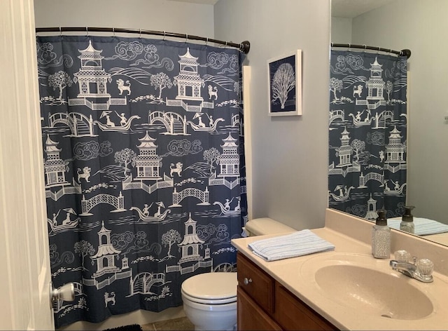 full bathroom featuring vanity and toilet