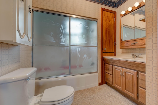 full bathroom featuring vanity, toilet, shower / bath combination with glass door, and decorative backsplash
