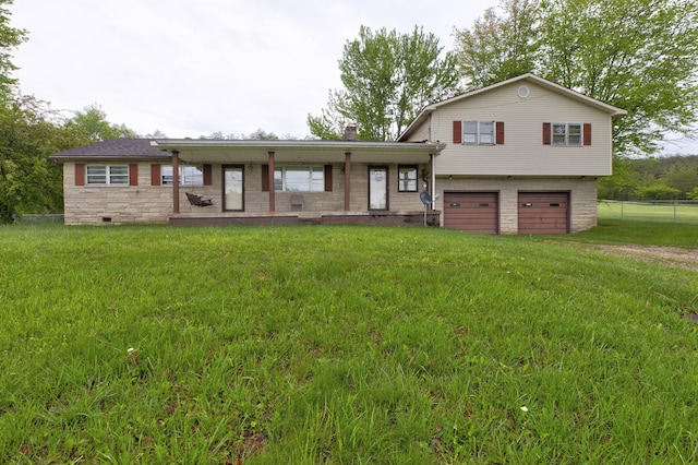 split level home with a garage, stone siding, and a front yard