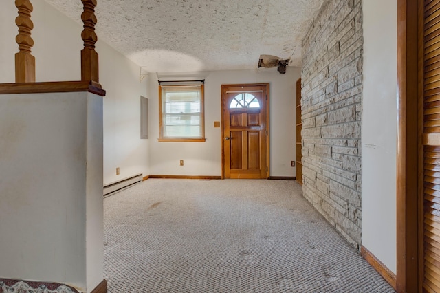 entrance foyer with a textured ceiling, carpet, baseboards, and a baseboard heating unit