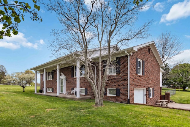 1141 Danville Rd, Lancaster, KY 40444 - view of side of home featuring a yard, brick siding, and an attached garage