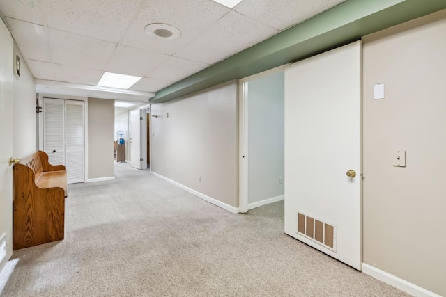 1141 Danville Rd, Lancaster, KY 40444 - finished basement featuring a paneled ceiling, carpet flooring, visible vents, and baseboards