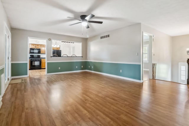 1141 Danville Rd, Lancaster, KY 40444 - unfurnished living room with light wood-style floors, visible vents, baseboards, and a ceiling fan