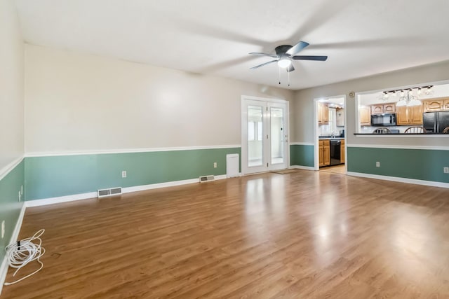 1141 Danville Rd, Lancaster, KY 40444 - unfurnished living room with baseboards, ceiling fan, light wood-style flooring, and visible vents