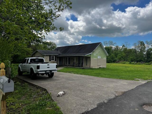 130 Trisler Ln, Junction City, KY 40440 - view of front of home with concrete driveway and a front yard