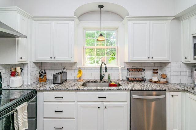 kitchen with stainless steel dishwasher, black / electric stove, a sink, and white cabinets