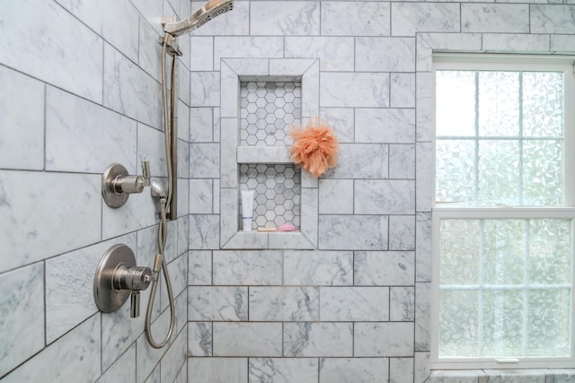 bathroom view of tiled shower