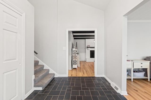 entryway with baseboards and stairway