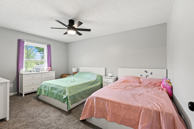 bedroom with carpet floors, a textured ceiling, a ceiling fan, and baseboards