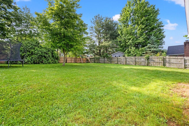 view of yard featuring a trampoline