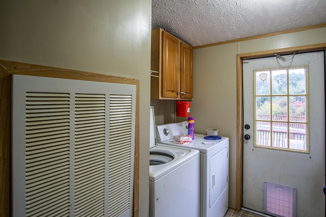 787 Wise Owl Rd, Keavy, KY 40737 - washroom with a heating unit, washer and clothes dryer, cabinet space, and a textured ceiling