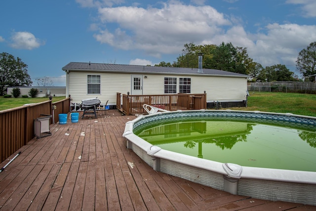 787 Wise Owl Rd, Keavy, KY 40737 - rear view of house with a yard, metal roof, fence, and a wooden deck