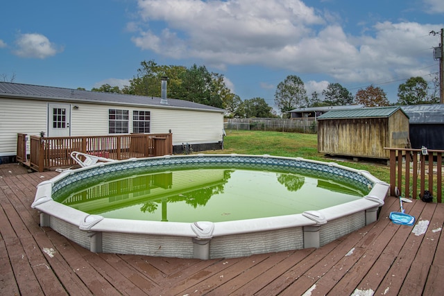 787 Wise Owl Rd, Keavy, KY 40737 - pool featuring an outdoor structure, fence, a deck, and a storage unit