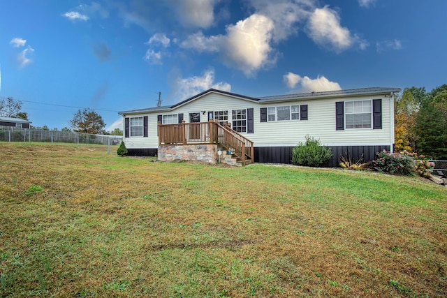 787 Wise Owl Rd, Keavy, KY 40737 - view of front of home with a deck, a front lawn, and fence