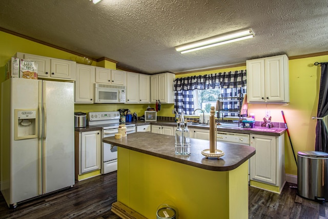 787 Wise Owl Rd, Keavy, KY 40737 - kitchen featuring dark countertops, dark wood finished floors, white cabinetry, and white appliances