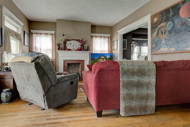 523 W High St, Mt Sterling, KY 40353 - living room with light wood-type flooring and a brick fireplace