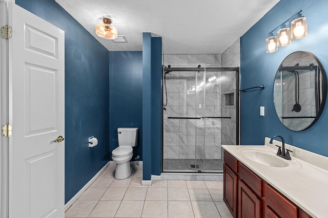 bathroom with toilet, a stall shower, tile patterned flooring, vanity, and a textured ceiling