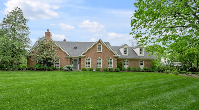 1775 Mooreland Dr, Lexington, KY 40502 - view of front of home featuring brick siding, a front yard, and a chimney