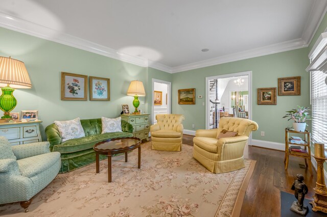 1775 Mooreland Dr, Lexington, KY 40502 - living room featuring crown molding, wood finished floors, baseboards, and a chandelier