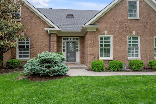 1775 Mooreland Dr, Lexington, KY 40502 - property entrance featuring brick siding, a shingled roof, and a yard