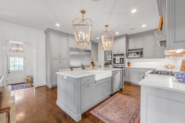 1775 Mooreland Dr, Lexington, KY 40502 - kitchen featuring gray cabinetry, a chandelier, built in appliances, a sink, and backsplash