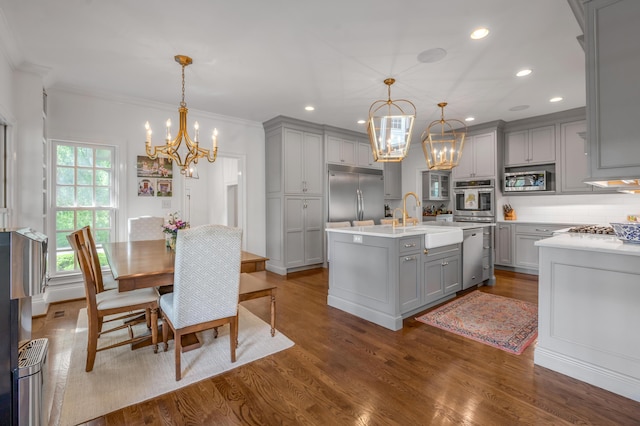 1775 Mooreland Dr, Lexington, KY 40502 - kitchen with gray cabinets, a chandelier, built in appliances, a sink, and recessed lighting