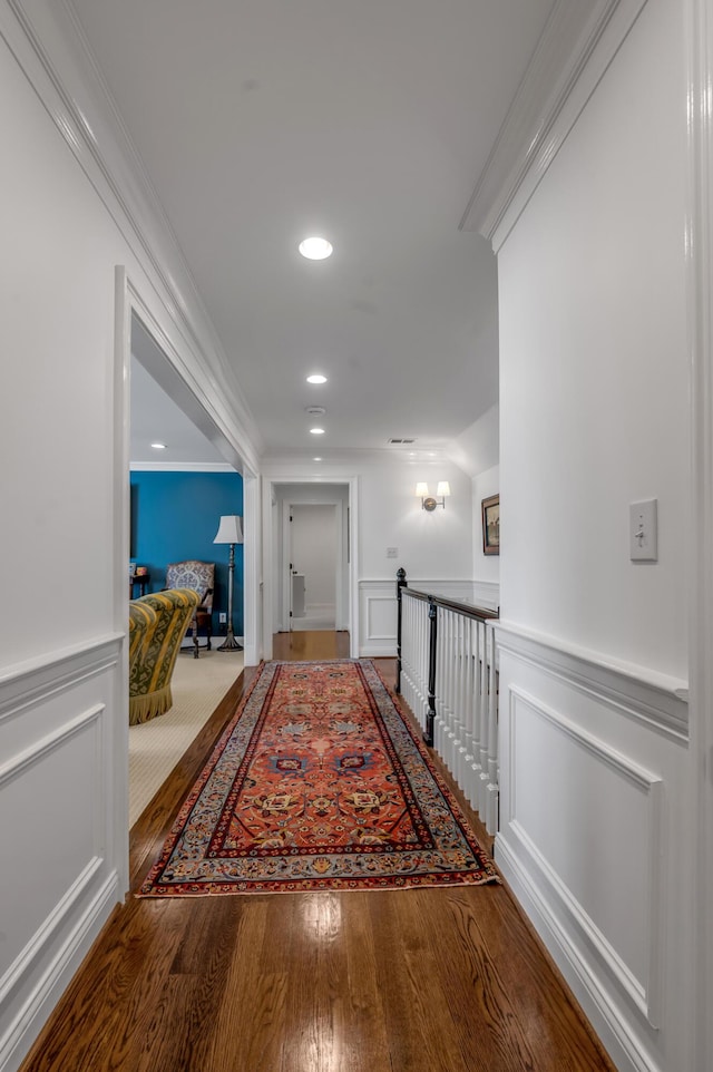1775 Mooreland Dr, Lexington, KY 40502 - corridor featuring an upstairs landing, crown molding, wood finished floors, a wainscoted wall, and a decorative wall