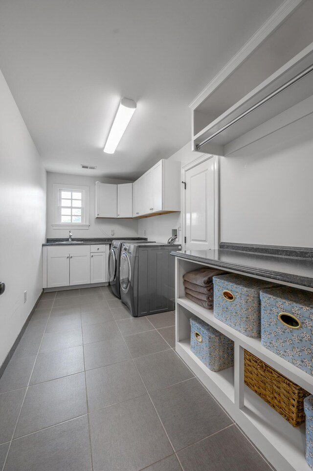 1775 Mooreland Dr, Lexington, KY 40502 - washroom with cabinet space, washer and dryer, and tile patterned floors