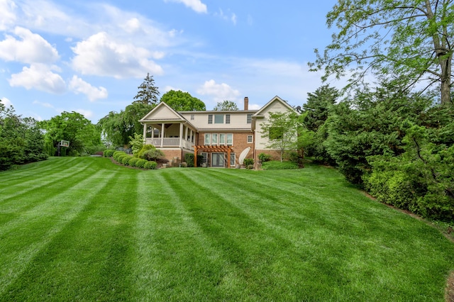 1775 Mooreland Dr, Lexington, KY 40502 - rear view of property with brick siding, a lawn, stairs, and a chimney