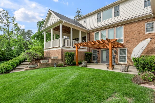 1775 Mooreland Dr, Lexington, KY 40502 - rear view of property featuring a pergola, brick siding, a patio, and a lawn