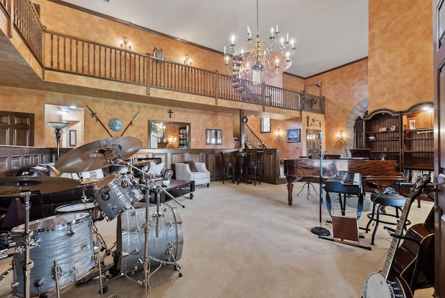 129 Adams Ln, Richmond, KY 40475 - misc room with carpet, a chandelier, a towering ceiling, and ornamental molding