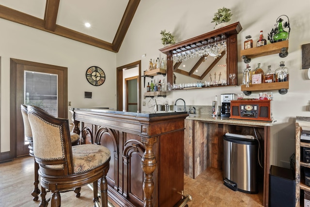 129 Adams Ln, Richmond, KY 40475 - bar with high vaulted ceiling, beamed ceiling, and indoor wet bar