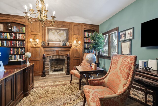 129 Adams Ln, Richmond, KY 40475 - living area with a chandelier, a fireplace, light wood-style flooring, and built in features