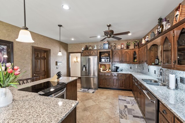 129 Adams Ln, Richmond, KY 40475 - kitchen with hanging light fixtures, glass insert cabinets, a sink, stainless steel appliances, and ceiling fan