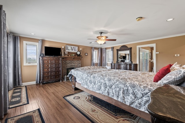 129 Adams Ln, Richmond, KY 40475 - bedroom with wood finished floors, a brick fireplace, crown molding, ceiling fan, and recessed lighting