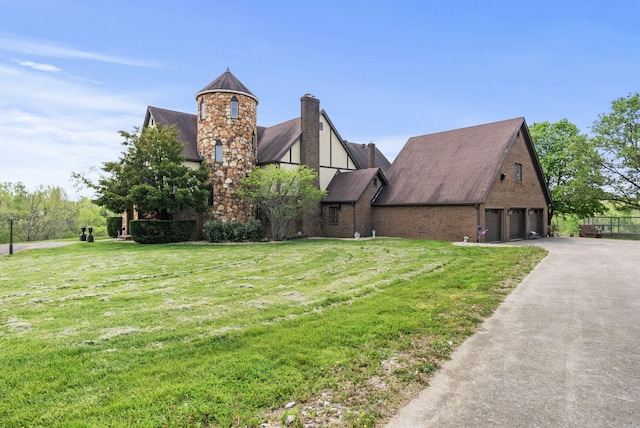 129 Adams Ln, Richmond, KY 40475 - view of front of home featuring aphalt driveway, brick siding, a front lawn, a chimney, and a shingled roof