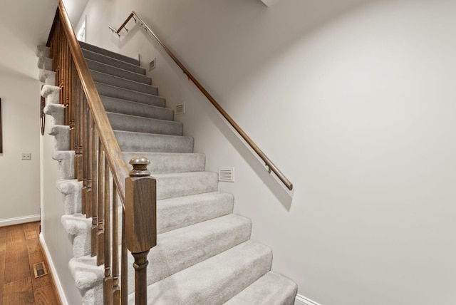 129 Adams Ln, Richmond, KY 40475 - stairs with wood finished floors, visible vents, and baseboards