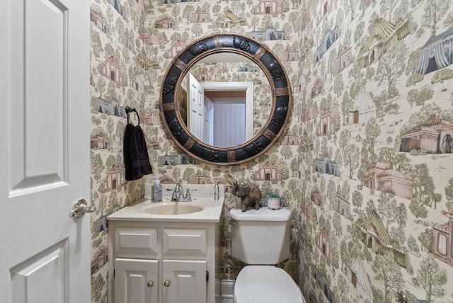 129 Adams Ln, Richmond, KY 40475 - half bathroom featuring toilet, vanity, and wallpapered walls