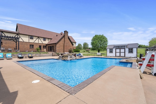 129 Adams Ln, Richmond, KY 40475 - outdoor pool with a pergola, a patio area, a jacuzzi, and an outbuilding