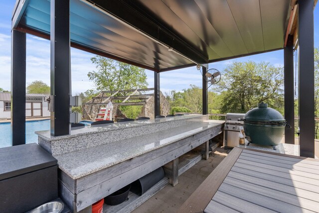 129 Adams Ln, Richmond, KY 40475 - wooden deck with a grill, an outdoor kitchen, and an outdoor pool