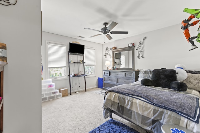 bedroom featuring carpet flooring, baseboards, and ceiling fan