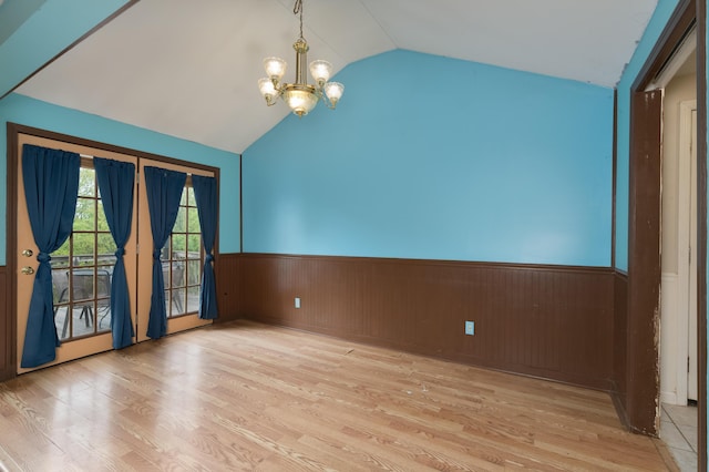 17590 New Columbus Rd, Corinth, KY 41010 - unfurnished room featuring lofted ceiling, an inviting chandelier, a wainscoted wall, and wood finished floors